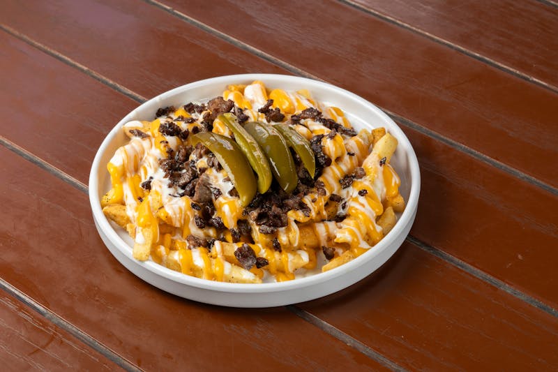 Loaded Ranch Fries with cheese, bacon, and sour cream