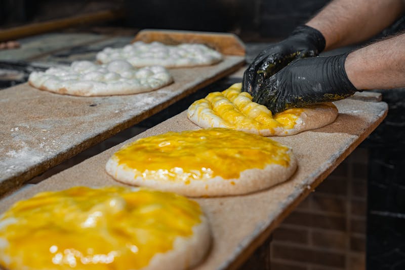 Chef crafting pizza dough with passion and skill
